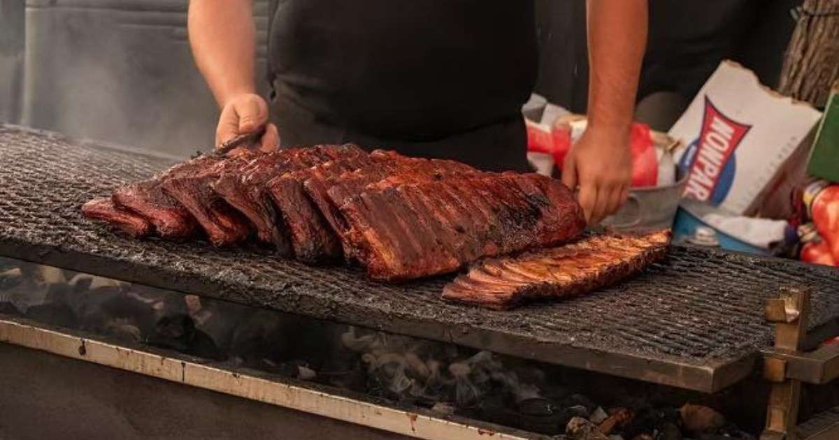 Someone cooking ribs at the Best in the West Rib Cook Off