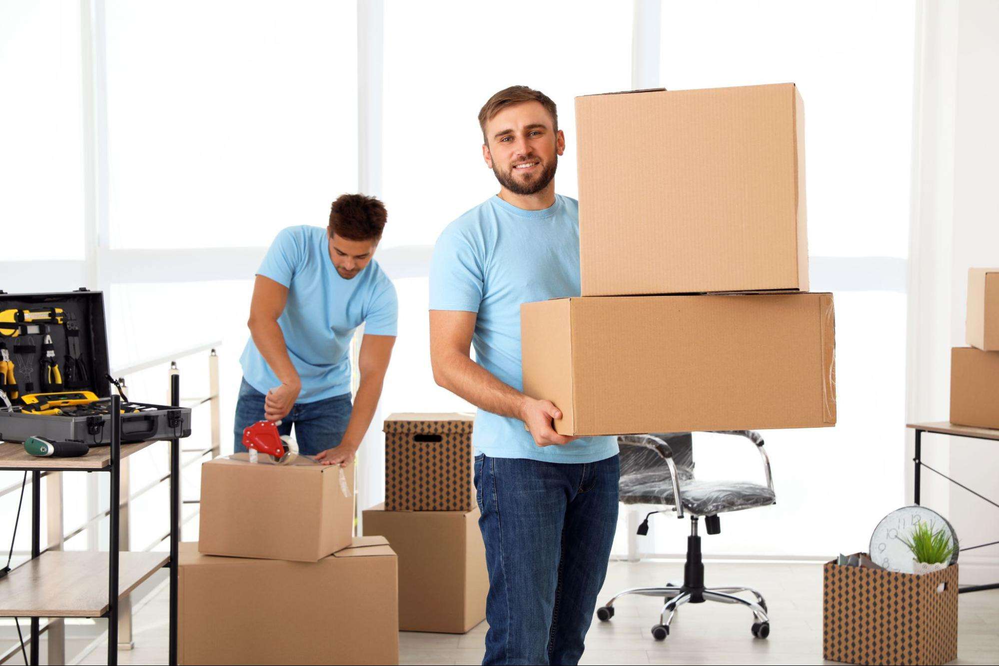 movers packing up boxes in an office
