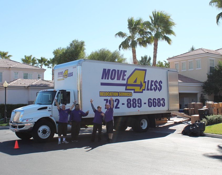 move 4 less truck and four waving movers in front of Las Vegas house